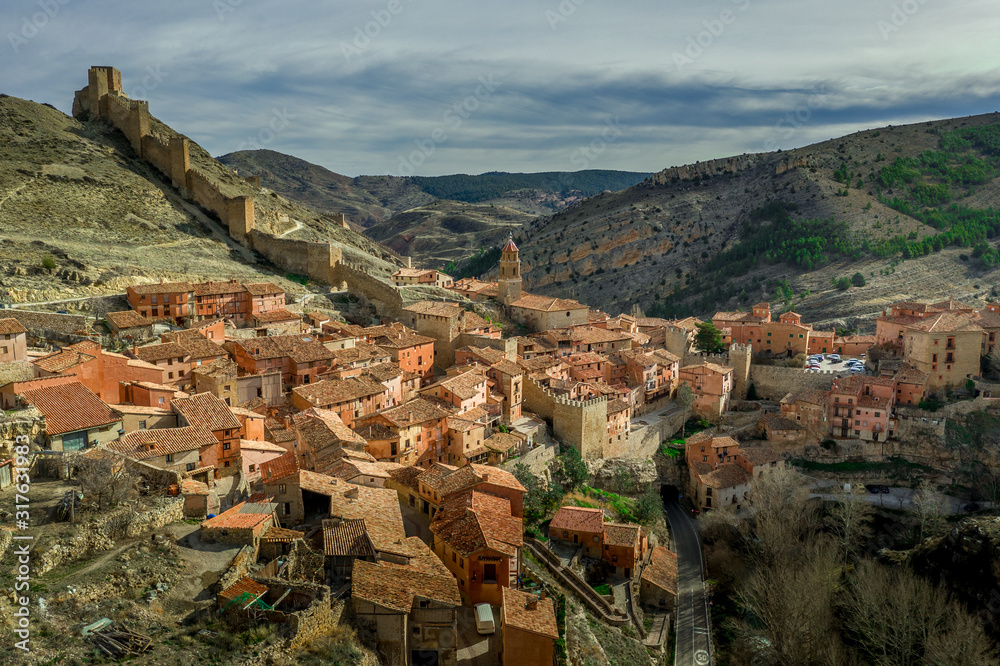 Aerial view of the medieval walls and towers surrounding Albarracin, voted the most beautiful village in Spain