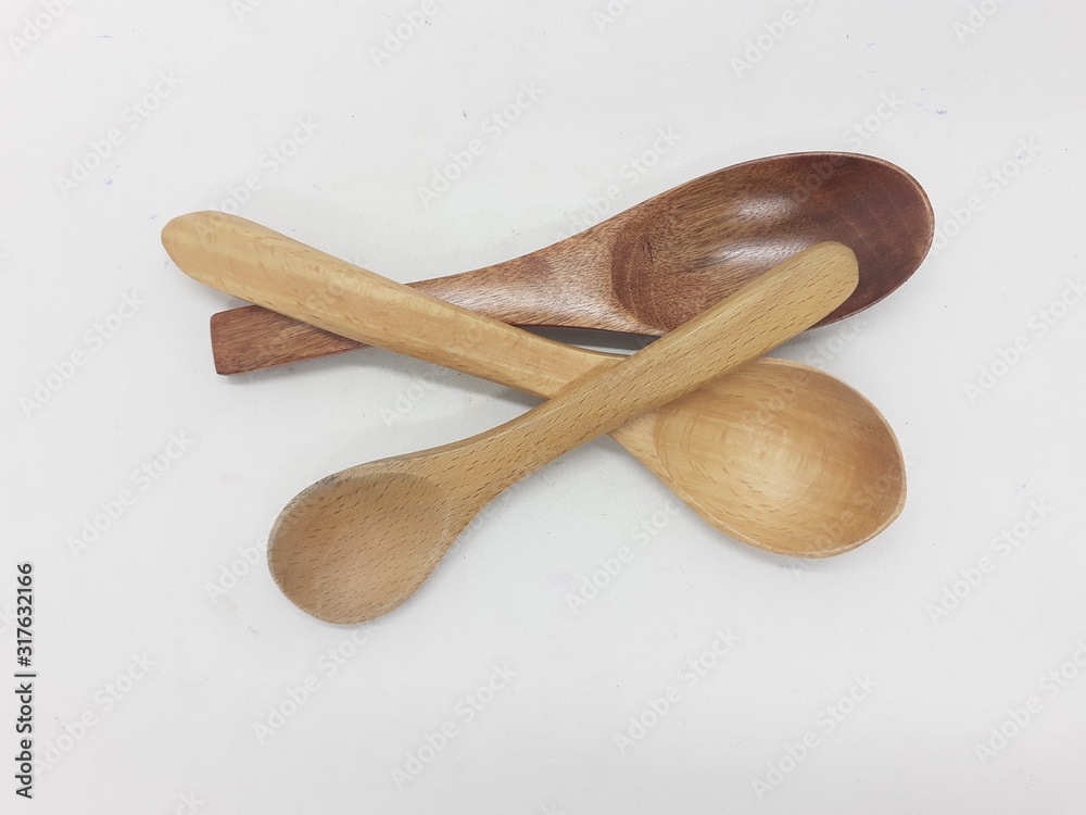Beautiful Cute Luxury Traditional Handmade Eating Cutlery Wooden Spoon Set for Dining Kitchen Appliances in White isolated Background Beautiful Cute Luxury Traditional Handmade Eating Cutlery Wooden Spoon Set for Dining Kitchen Appliances in White isolated Background