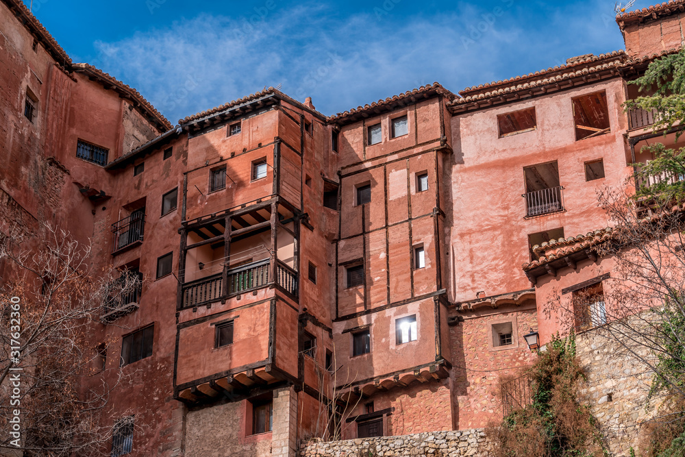 Terracotta red stone wall medieval buildings in Albarracin Spain voted most beautiful small town