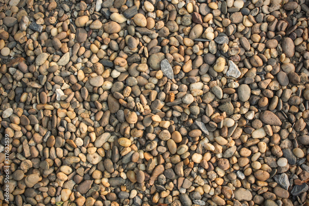 The background of a small stone lying on the ground The background of a small stone lying on the ground