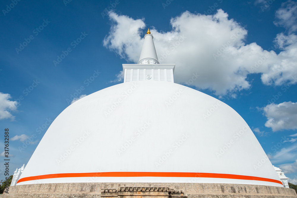 View of Ruwanwelisaya stupa in ancient city of Anuradhapura, Sri Lanka. Ruwanwelisaya stupa is one of the world's tallest ancient monuments and containing Buddha relics. View of Ruwanwelisaya stupa in ancient city of Anuradhapura, Sri Lanka. Ruwanwelisaya stupa is one of the world's tallest ancient monuments and containing Buddha relics.