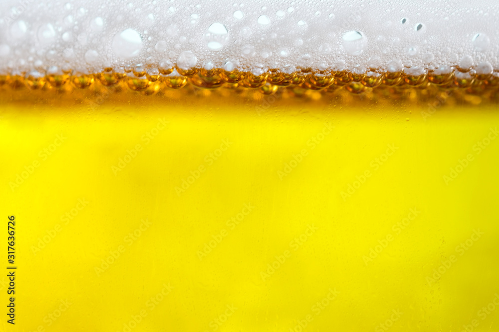 Background Cool beers with beer bubbles on top a glass at the party Background Cool beers with beer bubbles on top a glass at the party