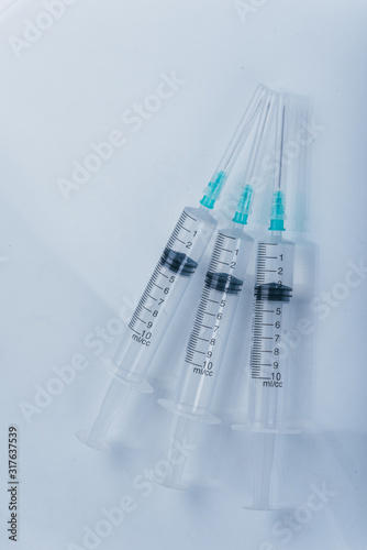 Medicine  Injection  vaccine and disposable syringe isolated  drug concept. Sterile vial medical. Medical Syringe needle. Macro close up on backgrounds gray.