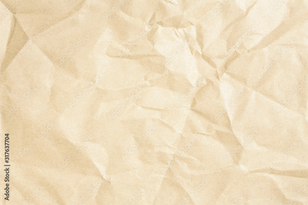 Obraz premium Crumpled brown paper background texture