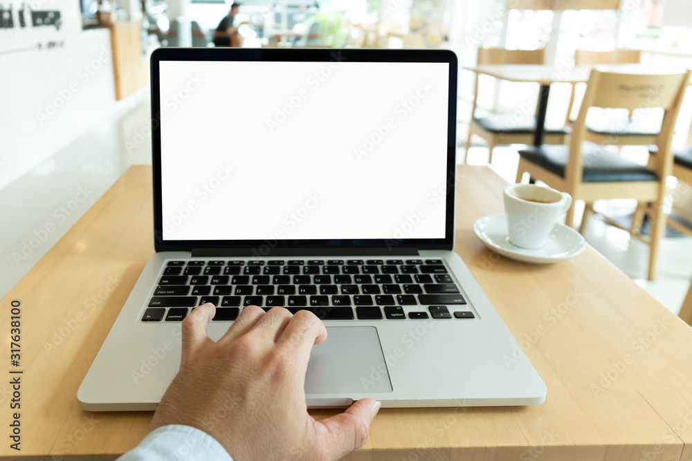 mockup image blank screen computer with white background for advertising text,hand man using laptop contact business search information on desk at coffee shop.marketing and creative design mockup image blank screen computer with white background for advertising text,hand man using laptop contact business search information on desk at coffee shop.marketing and creative design