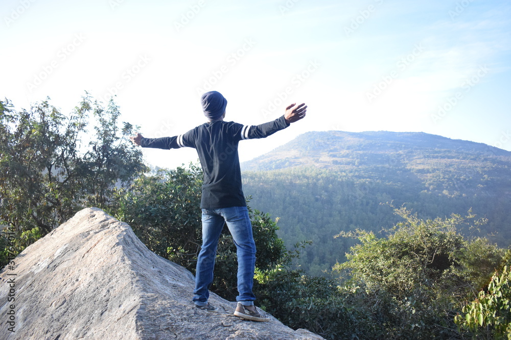 young man in the mountains