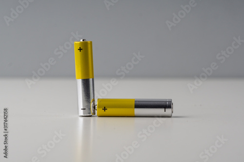Two AAA batery over white background.