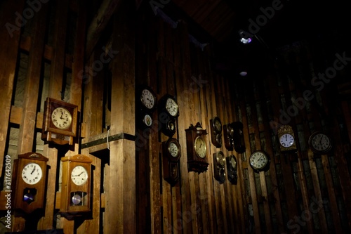 old clocks on wooden wall (ID: 317642509)