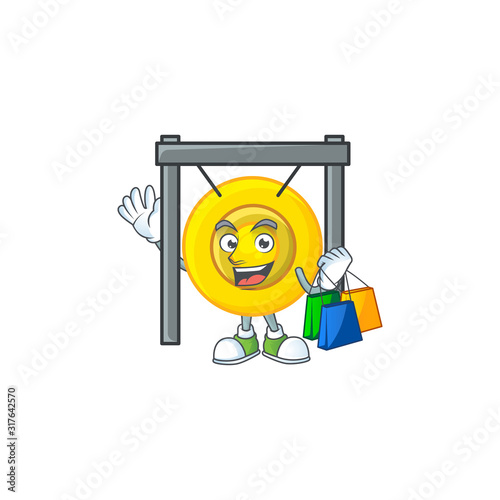 A happy rich chinese gong waving and holding Shopping bag