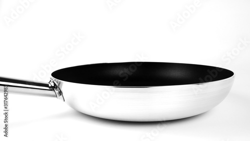 Black pan isolated on White background, Concept Kitchen in the restaurant, Front view with copy space for your text..