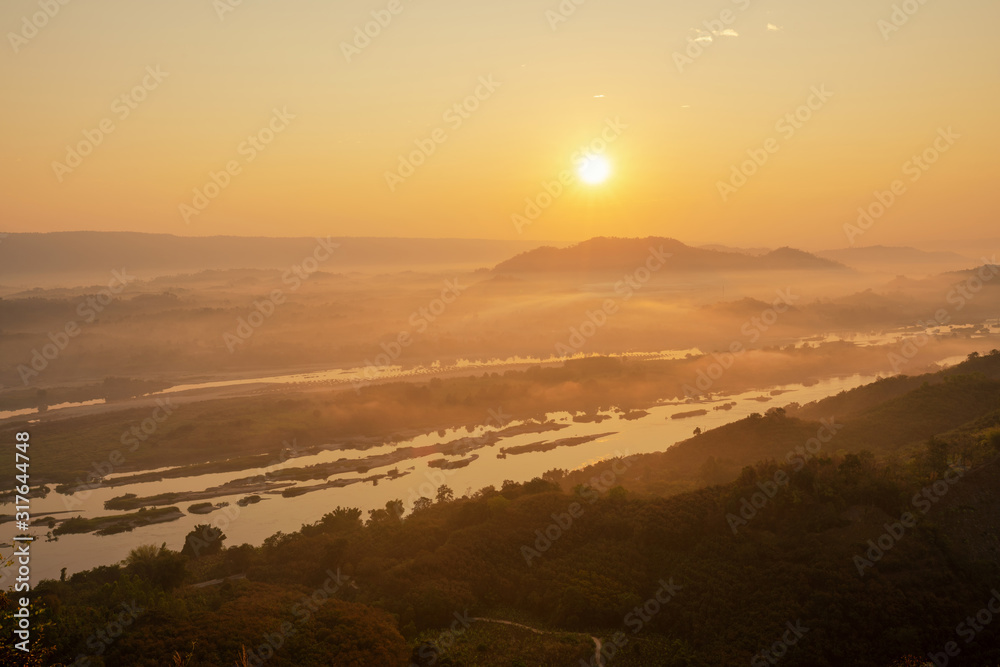 Beautiful sunrise at the Mekong river and foggy during sunrise