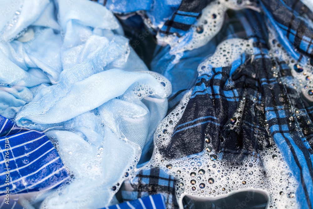Hand washing clothes, soaking clothes in washing powder, household