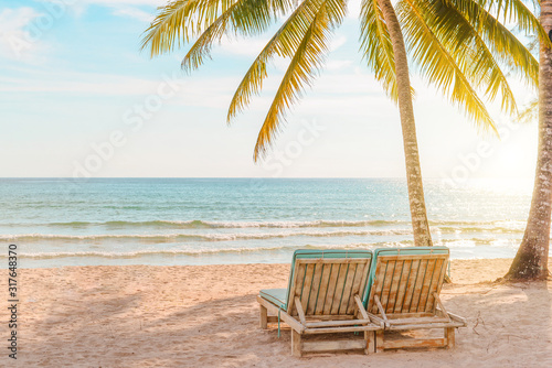 Chairs on the sandy beach near the sea,Beautiful beach,Summer holiday and vacation concept for tourism. Inspirational tropical landscape.