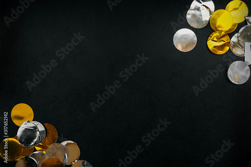 layout for placing text or your own element, black plain background and foil gold and silver circles for decoration