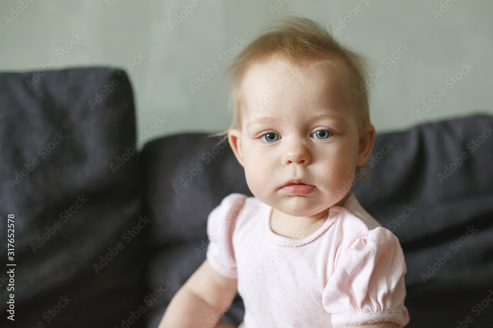 Sweet serious little infant girl portrait close-up Sweet serious little infant girl portrait close-up