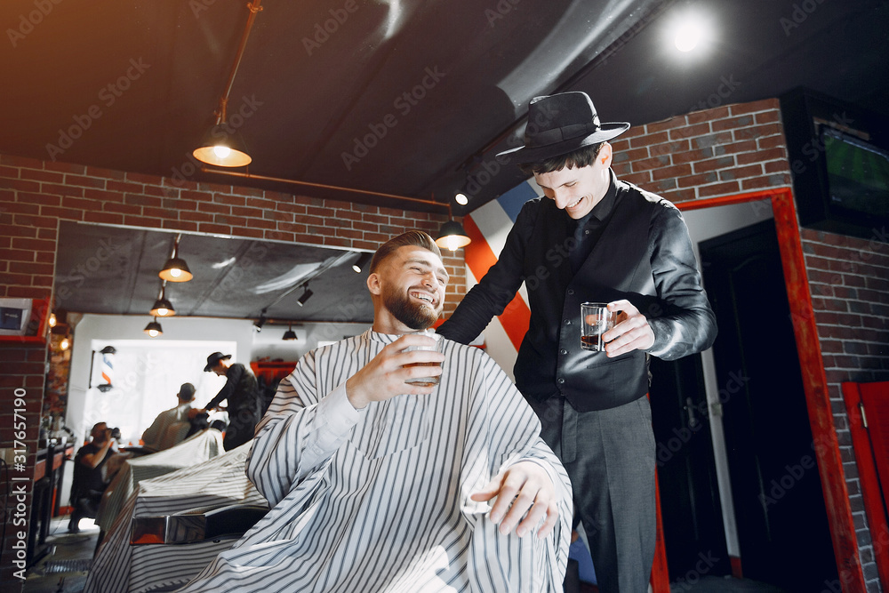 Man with a beard. Hairdresser with a client.