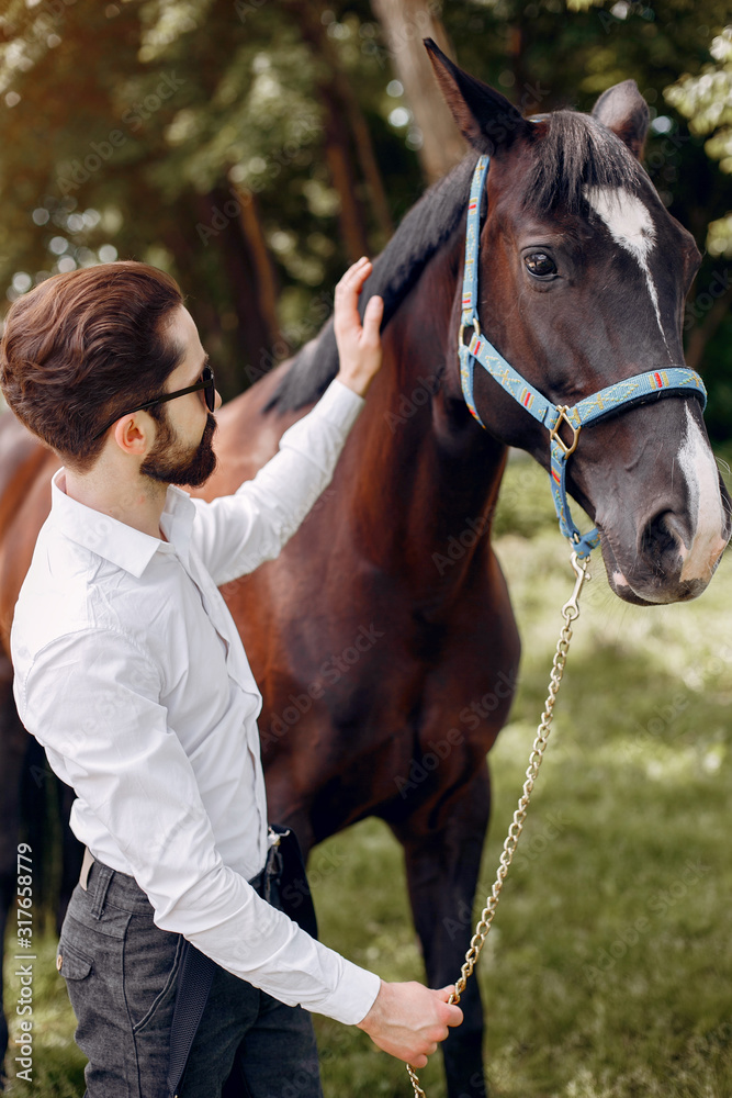 Horse theme. Businessman with a horse. Man in a suit Horse theme. Businessman with a horse. Man in a suit