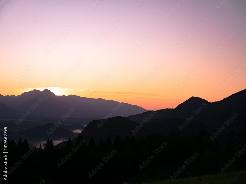 View on the beautiful sunrise over the majestic hills with the Lake Bled in Slovenia