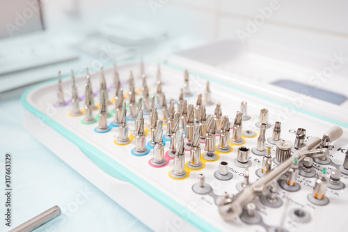 A set of tools for dental implantation. Drills, extenders and wrenches for implant installation.