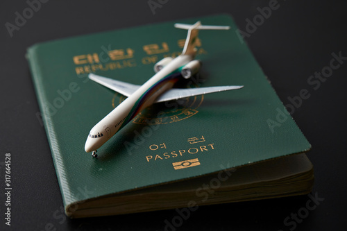 Republic of Korean passport with airplane model 