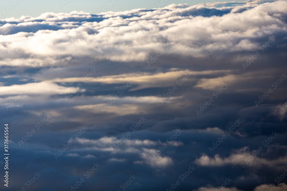 Aerial view of clouds seen from the plane window