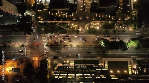 Aerial 4k birds eye view of Faria Lima Avenue in São Paulo, Brazil at night with cars passing by