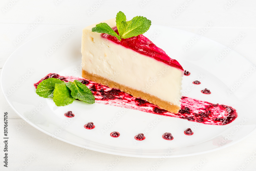 Slice of cheesecake garnished with mint garnished Slice of cheesecake garnished with mint garnished