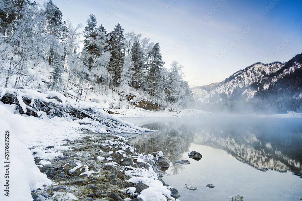 Winter landscape with a mountain lake