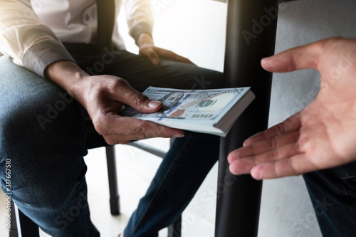 Businessman are accepting bribes under the table.