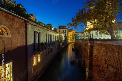 Beautiful photo of Venice at night. Light from the lanterns erupts in the canals of Venice