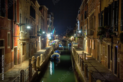 Beautiful photo of Venice at night. Light from the lanterns erupts in the canals of Venice © slava2271
