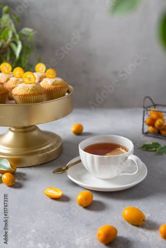 Lemon muffins and cup of tea for breakfast. Tea party. Bakery, patisserie, cafe menu concept. Copy space