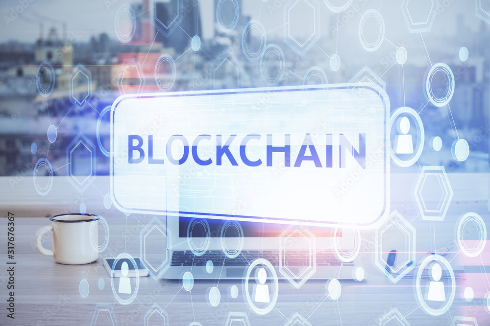 Double exposure of blockchain theme hologram and table with computer background. Concept of bitcoin crypto currency. Double exposure of blockchain theme hologram and table with computer background. Concept of bitcoin crypto currency.