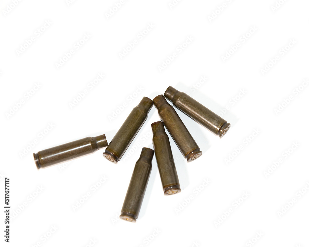 empty shells from cartridges for a firearm on a white background empty shells from cartridges for a firearm on a white background
