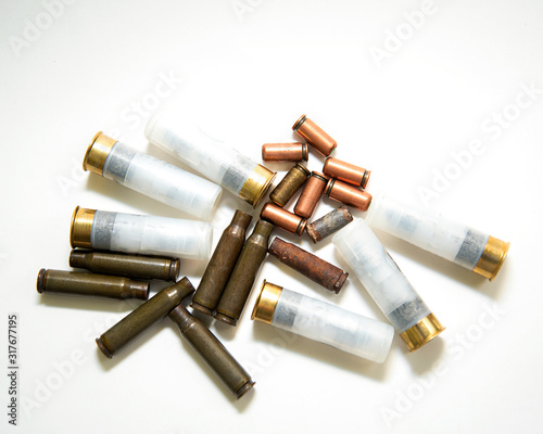 a lot of different ammunition and ammunition for firearms on a white background