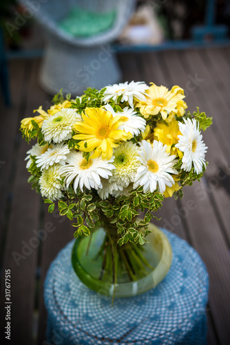 bouquet with gerbera flowers in shades of yellow and white in a garden greenhouse