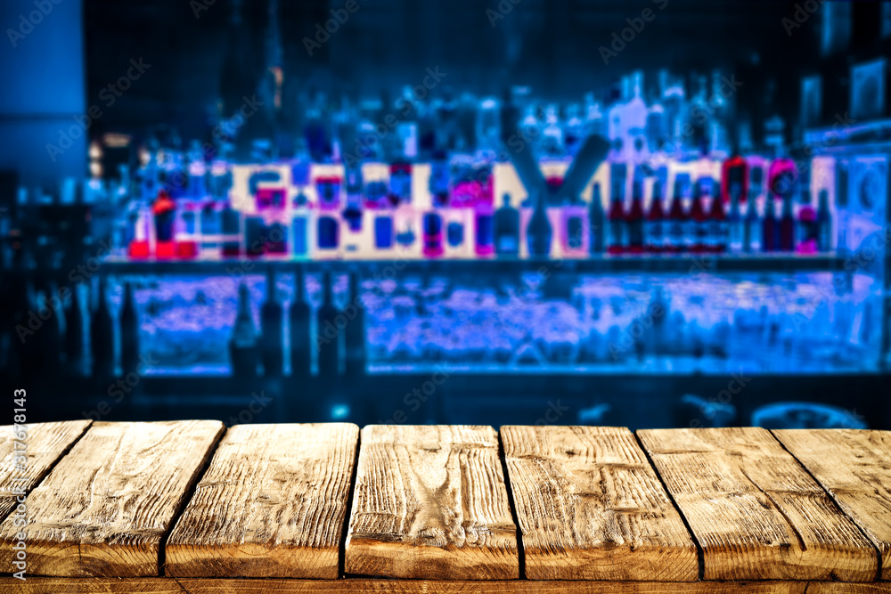 Desk of free space and blurred bar interior in restaurant 
