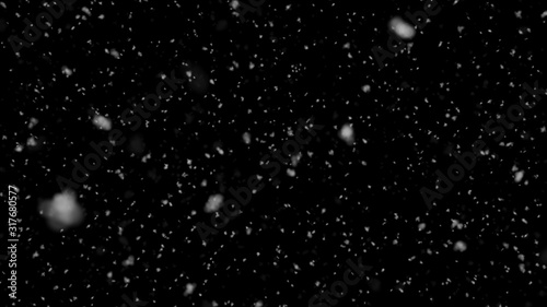 Falling slow snow isolated on black background in 4K to be used for composing, motion graphics, Large and small snow snowflakes, Isolated falling snow,