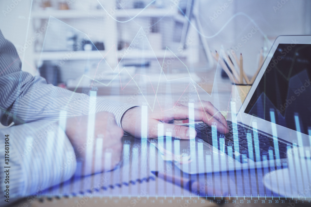 Multi exposure of stock market chart with man working on computer on background. Concept of financial analysis. Multi exposure of stock market chart with man working on computer on background. Concept of financial analysis.
