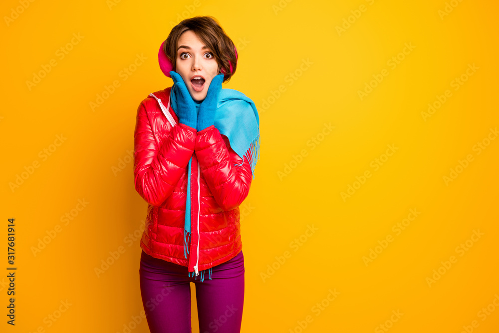 Photo of funny charming lady holding hands on cheekbones read winter sale advert banner wear casual red overcoat blue gloves trousers isolated yellow color background Photo of funny charming lady holding hands on cheekbones read winter sale advert banner wear casual red overcoat blue gloves trousers isolated yellow color background