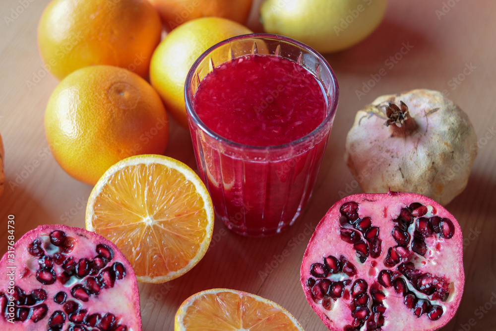 close up of fresh orange and pomegranate juice close up of fresh orange and pomegranate juice