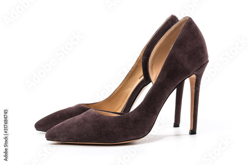 Stylish classic suede women's leather shoes with medium high heels on an isolated white background. Shoe sale / clearance concept announcement.
