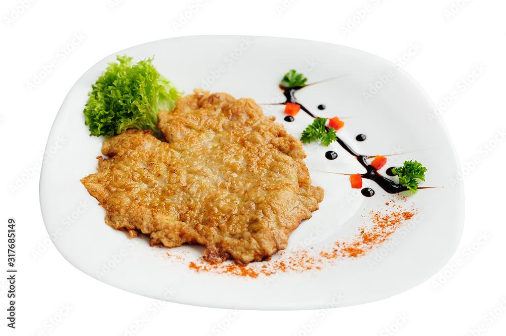 Schnitzel chop cutlet with a lettuce isolated on a white background Schnitzel chop cutlet with a lettuce isolated on a white background