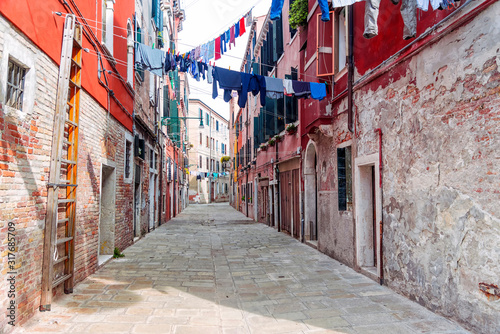 old street in Venice with hanging clothes © dimbar76