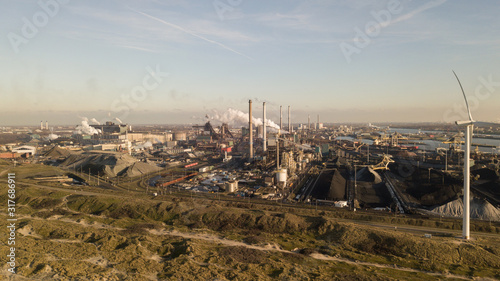 Konstfotografi Factory Tata Steel with smoking chimneys on a sunny day, IJmuiden, The Netherlan
