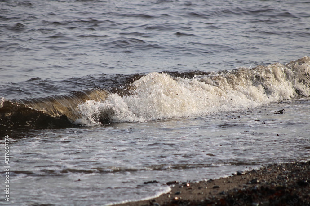 waves breaking on the shore waves breaking on the shore