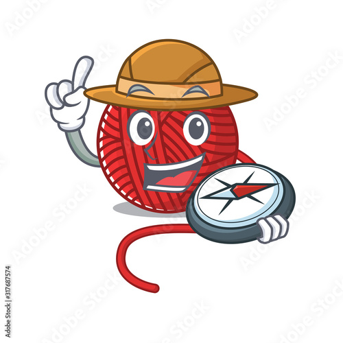 Red wool yarn stylized Explorer having a compass