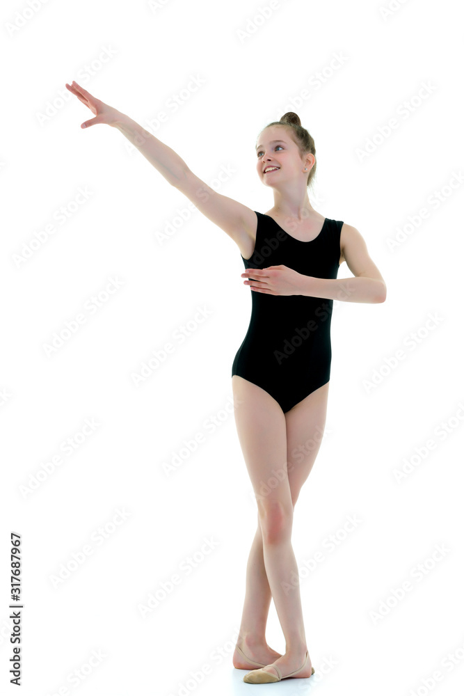 Little girl gymnast in a sports swimsuit.