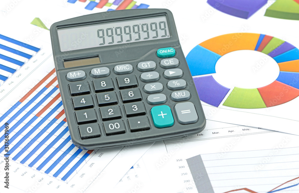 calculator on paper table with diagram calculator on paper table with diagram