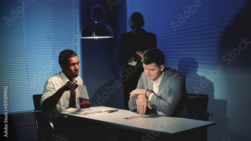 Photos African police detective showing pictures of suspected robber's accomplice